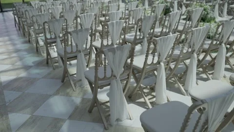 Rows of White Draped Chairs Set for Wedding Ceremony on Marble Terrace Stock Footage 343985781