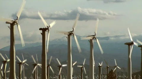Rows of wind turbines against mountains and sky - HD  Stock-Footage 357848