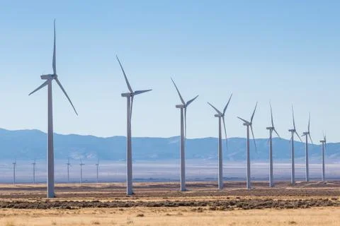 Rows of windmills in wind farm Stock Photos