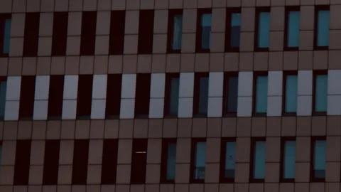 Rows of windows at each center of the painted brick -Closer View Stock Photos