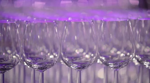 Rows of wine glasses at event with bar staff Stock Footage 37115448