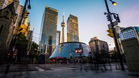 Roy Thomson Hall in front of CN tower in Toronto downtown time lapse Stockbeeldmateriaal 119136148