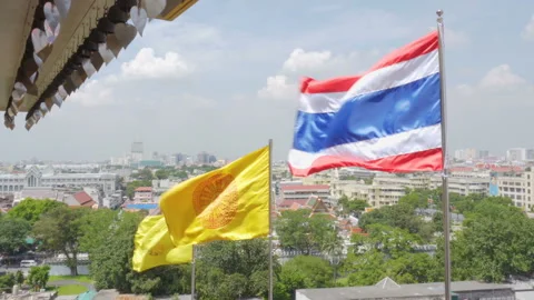 Royal and Buddhist flags fluttering over Bangkok, Thailand Stock Footage 99131519