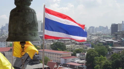 Royal and Buddhist flags fluttering over Bangkok, Thailand Stock Footage 99131543