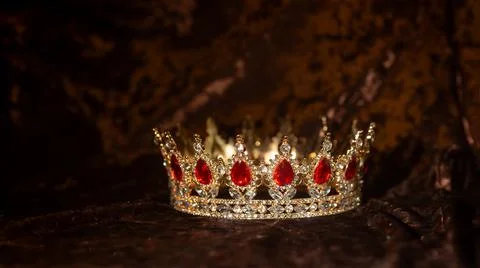 Royal crown red gems, ruby on velvet background 写真素材