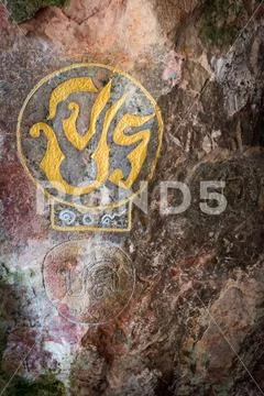 Royal cypher or monograms of Thailand king on rock wall Stock Photos