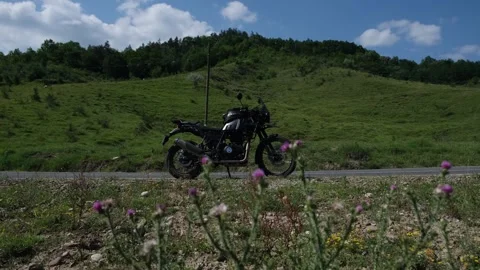 Royal Enfield Himalayan model is seen on a picturesque road Видео 245582129