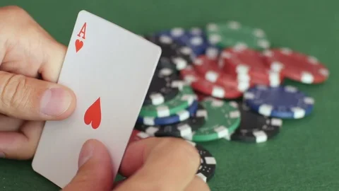 Royal flush of hearts on hands Stock Footage 70210540