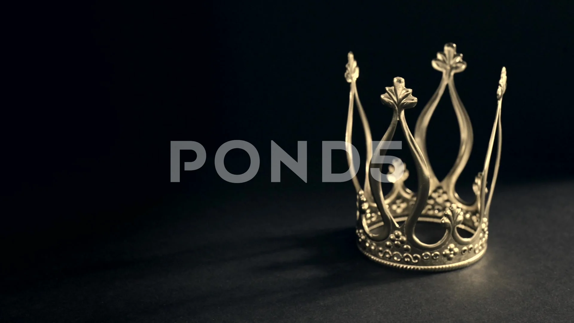 Royal gold crown on black background | Stock Video | Pond5