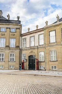 Royal guard standing sentry at Amalienborg Palace in Copenhagen Stock Photos
