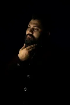 Royal looking beard man setting his beard Stock Photos