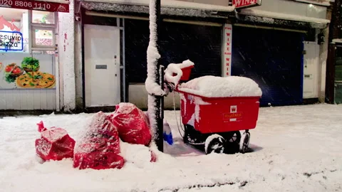 Royal Mail post trolley Uk under snow London Stock Footage 236107073