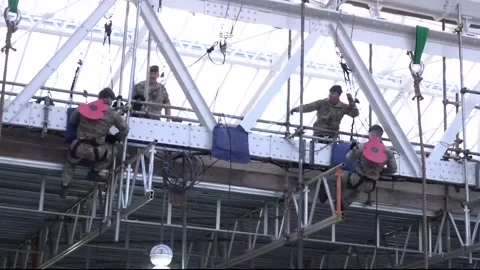 Royal Marines abseil at Waterloo to raise funds on London Poppy Day Stock Footage 320164564