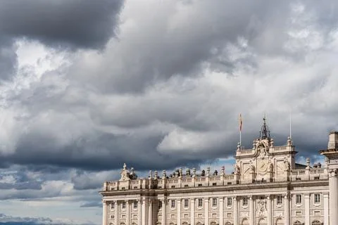 Royal Palace of Madrid under dramatic cloudy sky Stock Photos