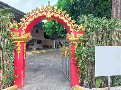 Royal red-yellow patterned gate of buddhist architecture, white board for text Stock Photos