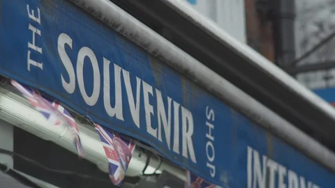 ROYAL WEDDING FLAGS ON LONDON SOUVENIR SHOP AWNING CANOPY Stock Footage