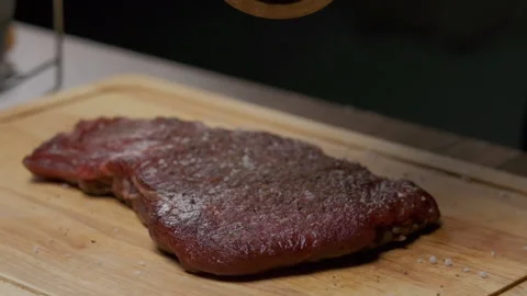 Рrofessional chef pepper meat steak. Close up slow motion Stock Footage 140042441