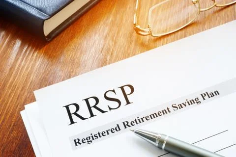 RRSP Registered Retirement Saving Plan documents on table. Stock Photos