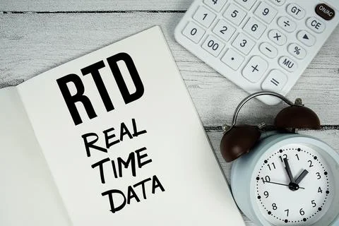 RTD Real Time Data text on paper notebook page with alarm clock and calcula.. Stock Photos