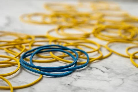 Rubber bands on table Stock Photos