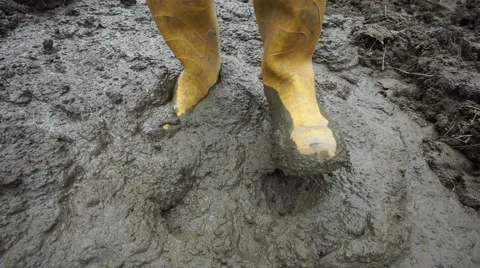 Rubber Boots Stepping in Muddy Ground Stock Footage 51850365