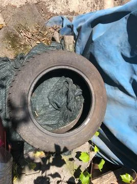 Rubber from car to garbage. Stock Photos