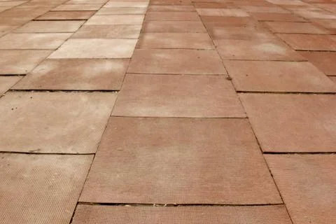 Rubber cluster floor. red square covering the ground close up. structure back Stock Photos