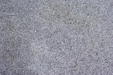 Rubber coating pattern of sports fields and tracks. Fine grey rubber chip. Safe Stock Photos