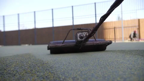 Rubber coating for playgrounds applied Stock Footage 196879280