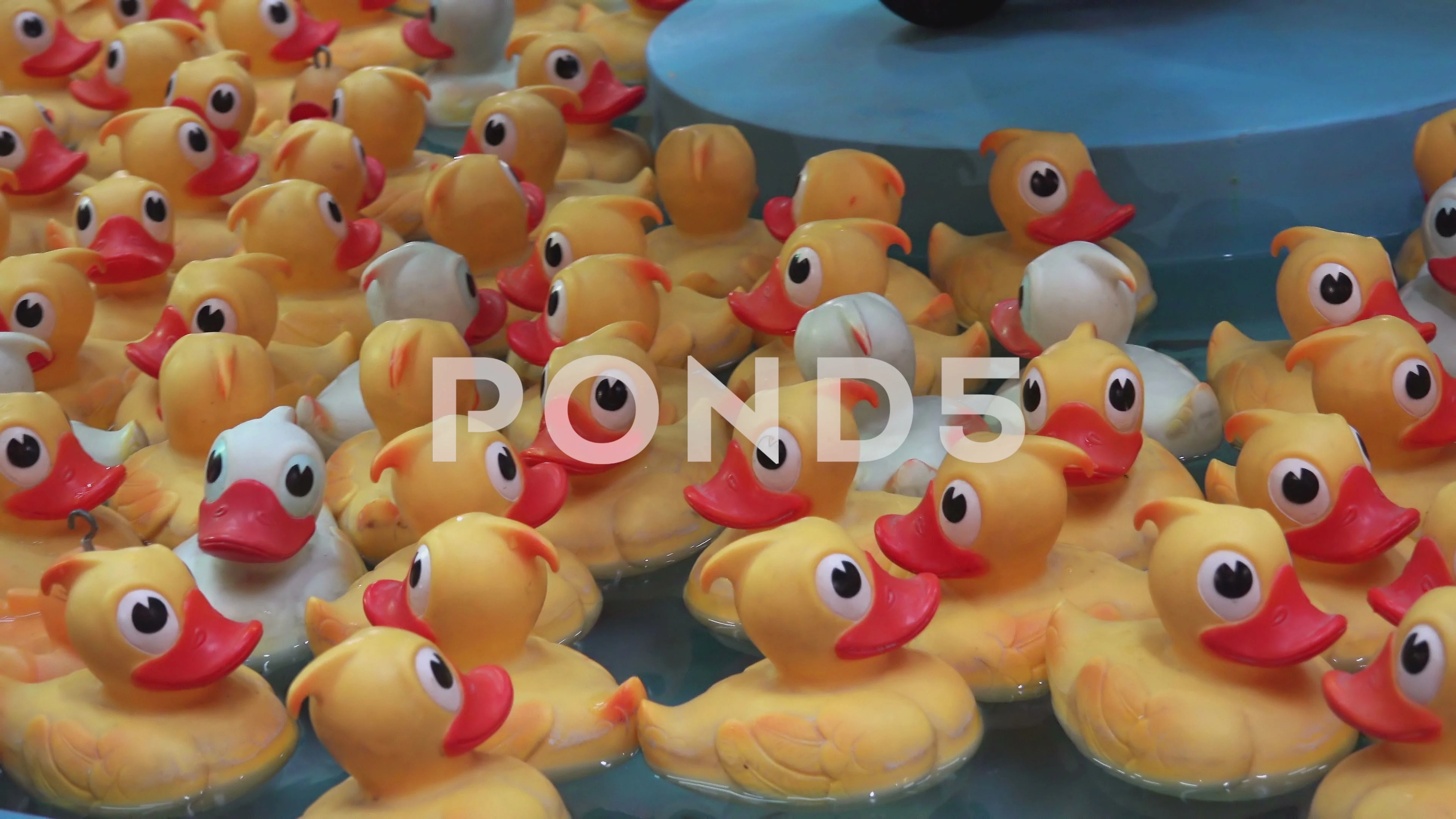 Rubber ducks fishing game on an arcade f, Stock Video
