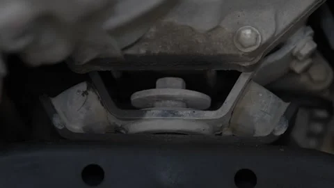 A rubber engine or transmission mount with a large central Stock Footage 343552321