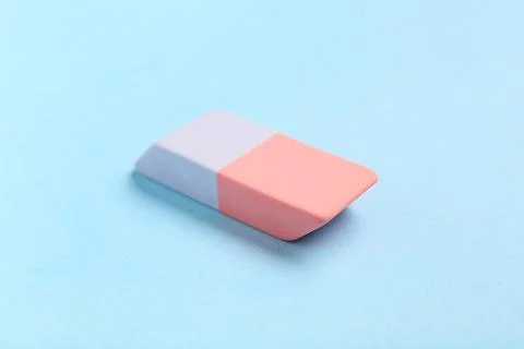 Rubber eraser on blue background, closeup 库存照片