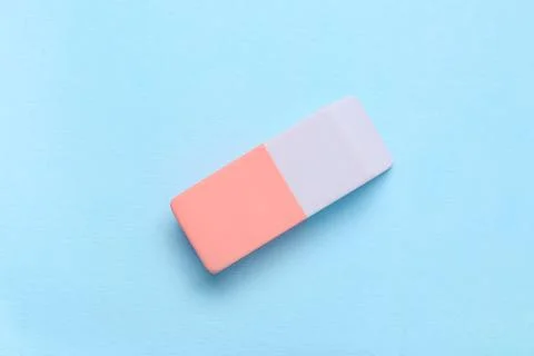 Rubber eraser on blue background 库存照片