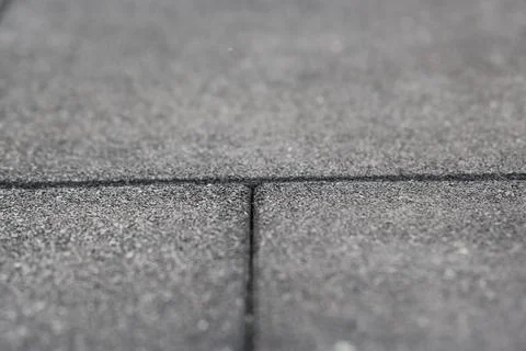 Rubber flooring is shown in a close-up view. This flooring is often used in.. Stock Photos