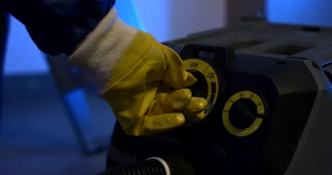 Rubber Gloved Hand Turning Rotary Control Dial, Industrial Cleaning Unit Stock-Footage 340325803