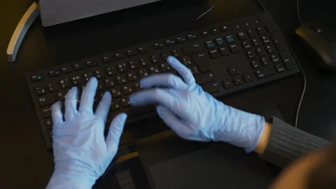 Rubber-gloved hands typing on eng-rus keyboard, prevent virus spreading Stock Footage 148437917