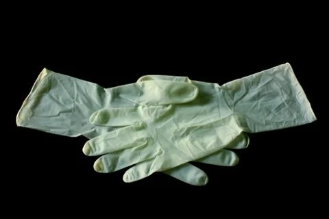 Rubber gloves on a black background Stock Photos