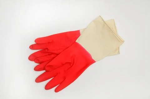 Rubber gloves for protecting hands during technical work on a white backgroun Stock Photos