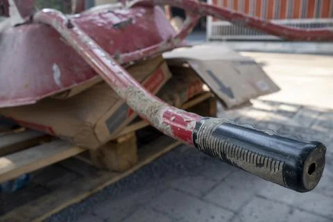 The rubber grip of a red train being placed on a paving block Stock Photos