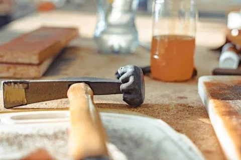 Rubber hammer on the table in the workshop Stock Photos