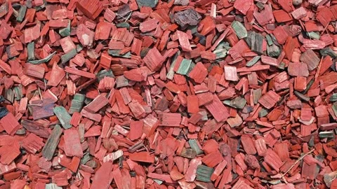 Rubber mulch is shown in four close-up frames, displaying its colorful texture Видео 344670855