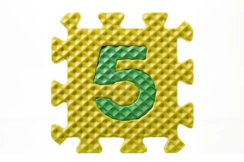 Rubber puzzle with number five Stock Photos