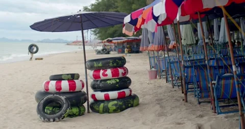 Rubber ring shop on sand beach for thai people and foreign travelers rent. Stock Footage 250635830