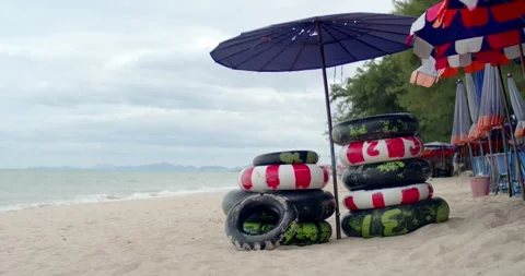 Rubber ring shop on sand beach for thai people and foreign travelers. Stock Footage 277847016
