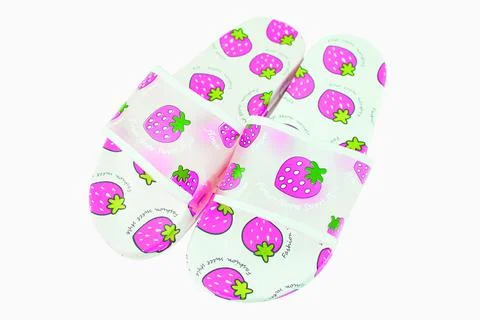 Rubber slippers with strawberry pattern white background. Stock Photos