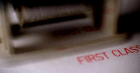 Rubber stamping that says 'First Class'. Many stamps Stock Footage 88731135