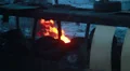 Rubber vehicle tires under fire, open fire outdoors winter cold HD Footage