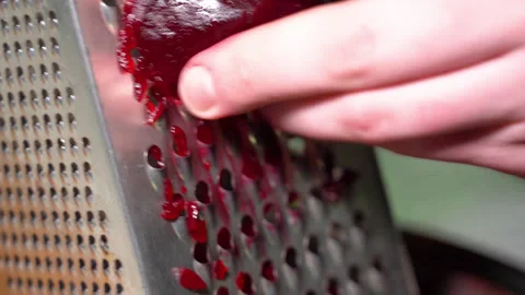 Rubbing the beetroot on metal grater Stock Footage 250546810