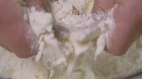 Rubbing butter into flour; close-up Stock Footage 64009817