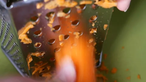 Rubbing carrots on the grater Stock-Footage 86589309